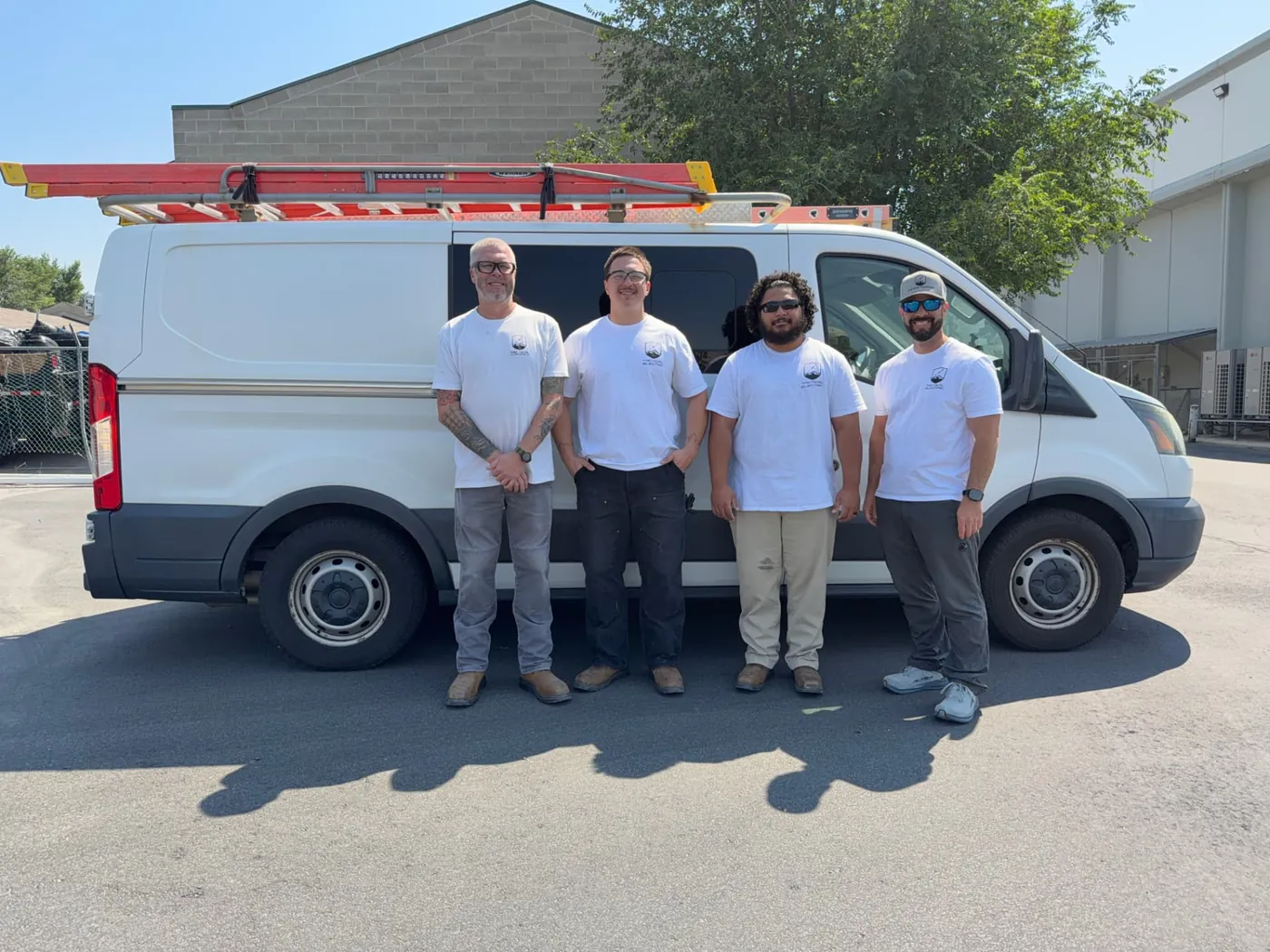 The Tactical Electrical Services crew in front of their service van in Utah